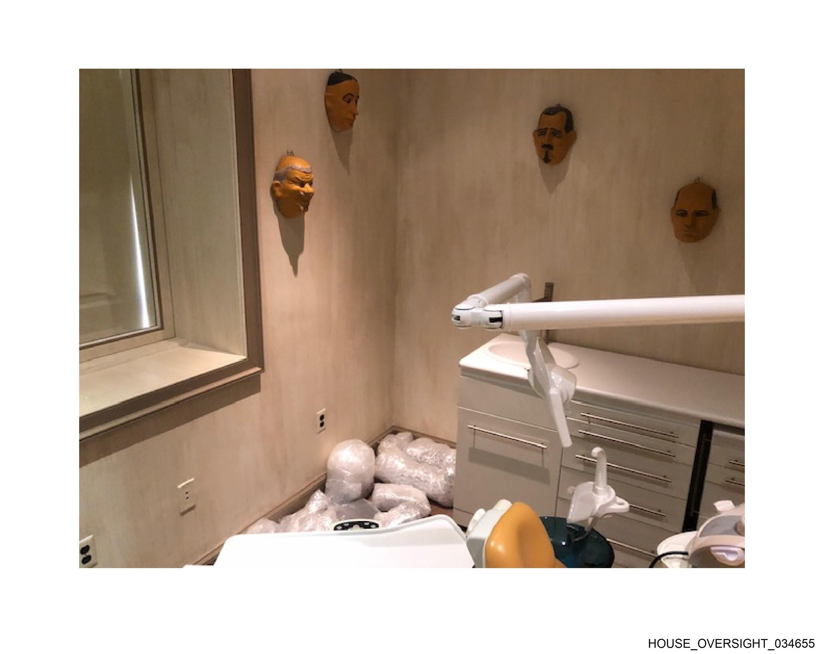 Dental chair with masks on wall