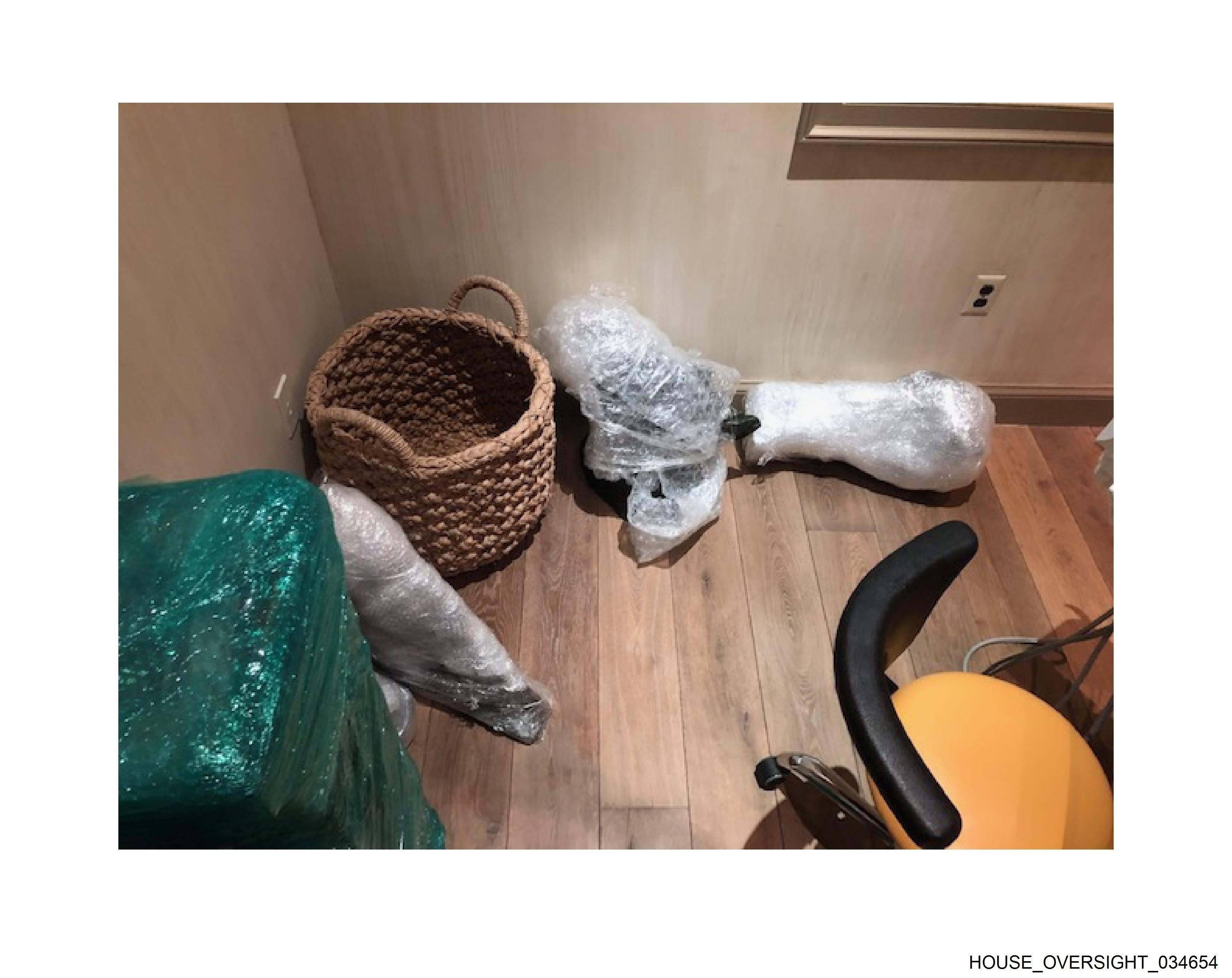 Wrapped sculptures on floor